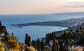 Panoramic view of Taormina shore at Ionian sea with Giardini Naxos and Villagonia towns in Messina region of Sicily in Italy Royalty Free Stock Photo