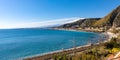 Panoramic view of Taormina shore at Ionian sea with Giardini Naxos and Villagonia towns and Mount Etna in Sicily in Italy Royalty Free Stock Photo