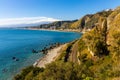 Taormina shore at Ionian sea with Giardini Naxos and Villagonia towns and Mount Etna volcano in Messina region of Sicily in Italy Royalty Free Stock Photo