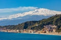 Taormina shore at Ionian sea with Giardini Naxos town and Mount Etna volcano in Messina region of Sicily in Italy Royalty Free Stock Photo