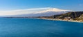 Taormina shore at Ionian sea with Giardini Naxos and Villagonia towns and Mount Etna in Messina region of Sicily in Italy Royalty Free Stock Photo