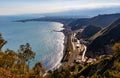 Panoramic view of Taormina shore at Ionian sea with Giardini Naxos and Villagonia towns and Mount Etna volcano in Sicily in Italy Royalty Free Stock Photo