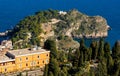 Panoramic view of Taormina with Capo Mazzaro cape and residential estates on Ionian sea shore in Messina region of Sicily in Italy Royalty Free Stock Photo