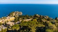 Panoramic view of Taormina with Capo Mazzaro cape and residential estates on Ionian sea shore in Messina region of Sicily in Italy Royalty Free Stock Photo