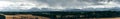 Panoramic view on Tatra Mountains, Poland seen from further. Snow-covered peaks of the rocky mountains and cloudy sky in the time Royalty Free Stock Photo