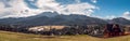 Panoramic view on Tatra Mountains seen from Koscielisko, Poland. Sunny day in early spring. Snow-covered peaks of the Tatras, Royalty Free Stock Photo