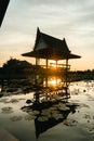 Panoramic View of Thai style waterfront pavilion in Silhouette. Wooden Pavilion Among The Lotus Farm. pavilion at sunset Royalty Free Stock Photo