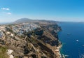 Panoramic view on Thira town and rocky coastline of Santorini island, Greece. Royalty Free Stock Photo