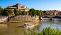 Tiber river and Lungotevere degli Altoviti embankment aside Ponte Sant`Angelo Saint Angel Bridge in Rome in Italy Royalty Free Stock Photo