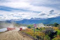 Panoramic view of Tierra del Fuego National Park, showing mountains surrounded by green vegetation and water, against a Royalty Free Stock Photo