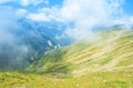 A panoramic view to canyon between a chain of green mountains pe Royalty Free Stock Photo