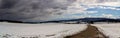 Panoramic view to hill Klet in winter. Czech landscape with road and snow field