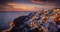 Panoramic view to the illuminated village Oia at the edge of the caldera at Santorini island Royalty Free Stock Photo