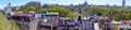 Panoramic view to Kiev, Kyiv, Ukraine. Vozdvizenka, new colorful buildings, sunny spring day with Andrew`s church on horizon Royalty Free Stock Photo