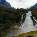 Panoramic view to kleivafossen waterfall at briksdalselva river, Briksdalsbreen glacier, Norway Royalty Free Stock Photo