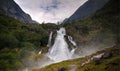 Panoramic view to kleivafossen waterfall at briksdalselva river, Briksdalsbreen glacier, Norway Royalty Free Stock Photo