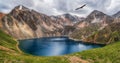 Panoramic view to mountain lake on background of mountains. Atmospheric green landscape with lake in high mountain valley. Great Royalty Free Stock Photo