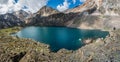 Panoramic view to mountain lake on background of mountains. Atmospheric green landscape with lake in high mountain valley. Great Royalty Free Stock Photo