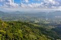 Panoramic view to mountains, tropical forest, Yanoda Park and Sanya city. Rainforest cultural tourism zone Yanoda, Hainan island, Royalty Free Stock Photo