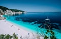 Panoramic view to remote beach wiht lonely white catamaran yacht drift in clear blue Caribbean like sea water. Tourists Royalty Free Stock Photo