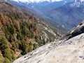 View from the Top of Moro Rock with its solid rock texture, overlooking mountains and valleys - Sequoia National Park