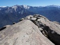 Standing at the edge of Moro Rock overlooking snowy mountains and valleys - Sequoia National Park Royalty Free Stock Photo