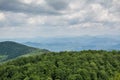 Panoramic view from the top of mountain to many mountain peaks around Royalty Free Stock Photo