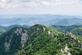 Panoramic view from the top of mountain to many mountain peaks around Royalty Free Stock Photo