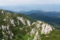 Panoramic view from the top of mountain to many mountain peaks around Royalty Free Stock Photo