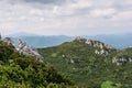 Panoramic view from the top of mountain to many mountain peaks around Royalty Free Stock Photo