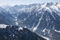 Panoramic view from top of slope on snow capped mountains. Karakol ski resort in Kyrgyzstan