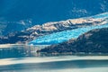 Panoramic view of Torres del Paine National Park, its Grey lagoon and glacier at Autumn, Patagonia, Chile, sunny day, blue sky