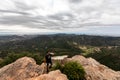 Panoramic View Of Tourist On Mountain Peak