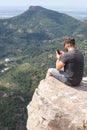 Panoramic View Of Tourist On Mountain Peak