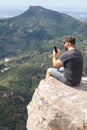 Panoramic View Of Tourist On Mountain Peak