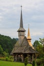 Panoramic view of traditional ancient Maramures wooden orthodox church in Transylvania with highest wooden belltower in Royalty Free Stock Photo