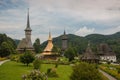 Panoramic view of traditional ancient Maramures wooden orthodox church in Transylvania with highest wooden belltower in Royalty Free Stock Photo