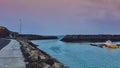 Panoramic view of traditional old wooden fishing boats lying in the harbor in beautiful golden evening light at sunset Royalty Free Stock Photo