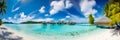 Panoramic view of a tropical beach with bungalows, illustrator ai generative