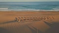 Panoramic view tropical beach ocean surf. Aerial empty recliners and umbrellas