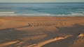 Panoramic view tropical beach ocean surf. Aerial empty recliners and umbrellas