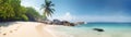 Panoramic view of a Tropical beach paradise with a coconut palm tree ina white sand with blue sky. Generative AI