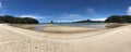 Panoramic view of two kayaks with low tide in Anchorage bay, a beach in Abel Tasman National Park