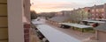 Panoramic view typical apartment complex with detached garage, covered parking lots at sunrise