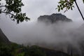 Panoramic view of unique rock formations near mountain Aghio Pnevma (Holy Spirit) on cloudy foggy day in Kalambaka, Meteora