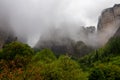 Panoramic view of unique rock formations near mountain Aghio Pnevma (Holy Spirit) on cloudy foggy day in Kalambaka, Meteora