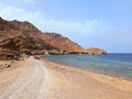 Panoramic view of unpaved road in the desert of the Sinai Peninsula. Berber village next to the Blue Hole on the Red Sea coast.