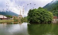 Panoramic view of Uzungol which is a tourist attraction in Trabzon, Turkey. Uzungol with stork birds Royalty Free Stock Photo