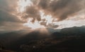 Panoramic view of a valley surrounded by hills at sunset with the sun Royalty Free Stock Photo
