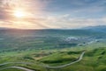 Beautiful landscape of valley with village and rural road in morning sunlight sky Royalty Free Stock Photo